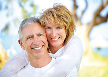 Photo of a couple smiling. Link to Life Stage Gift Planner Under Age 60 Situations.