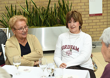 People having a conversation at a table. Links to Gifts of Appreciated Securities People having a conversation at a table. Links to Gifts of Appreciated Securities