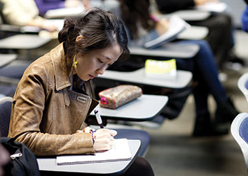 A student writing in class. Links to Closely Held Business Stock A student writing in class. Links to Closely Held Business Stock